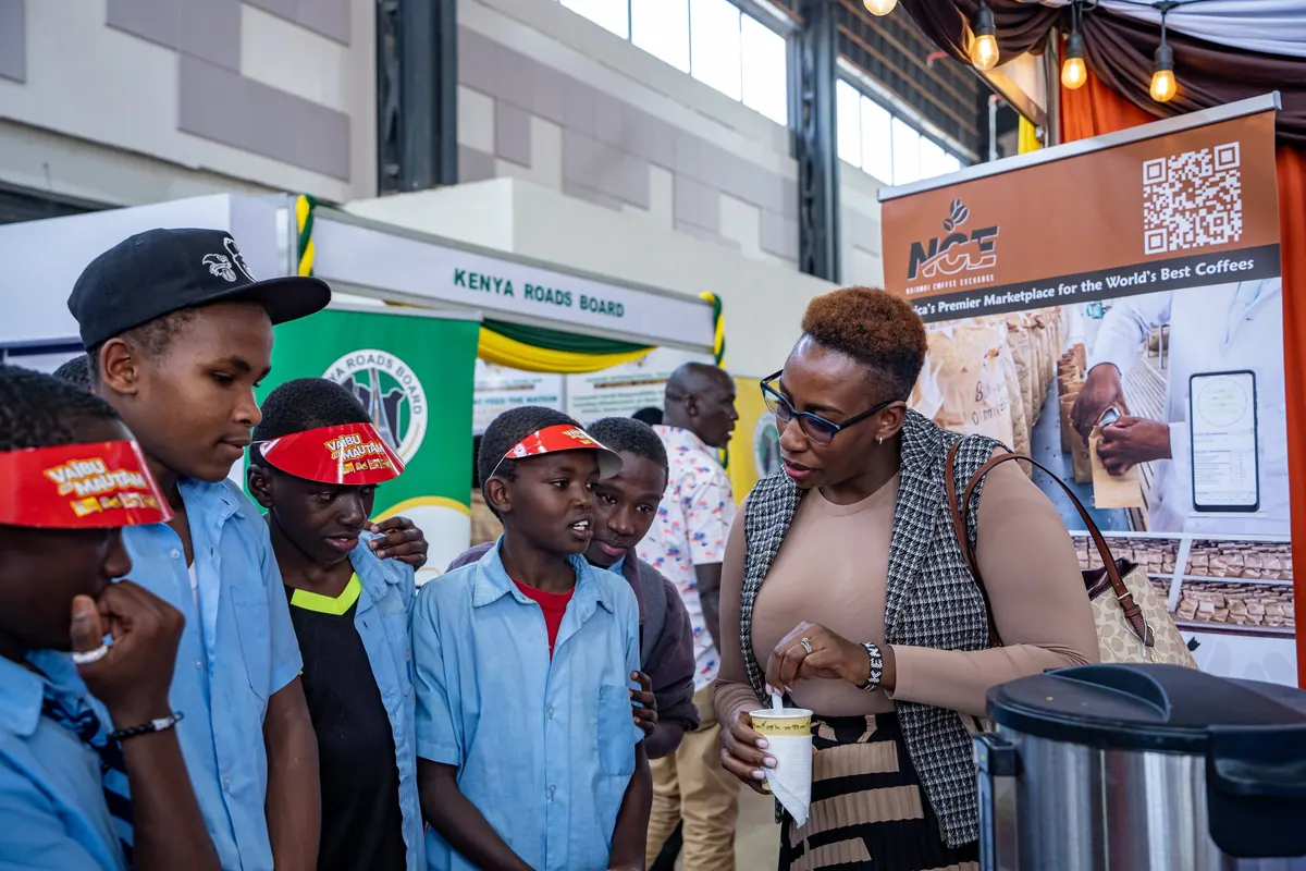 A Nairobi Coffee Exchange speaker talking coffee with visiting school pupils