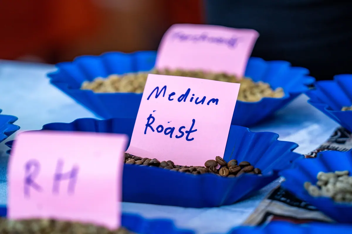 Bowls of roasted coffee with a handwritten Medium Roast label