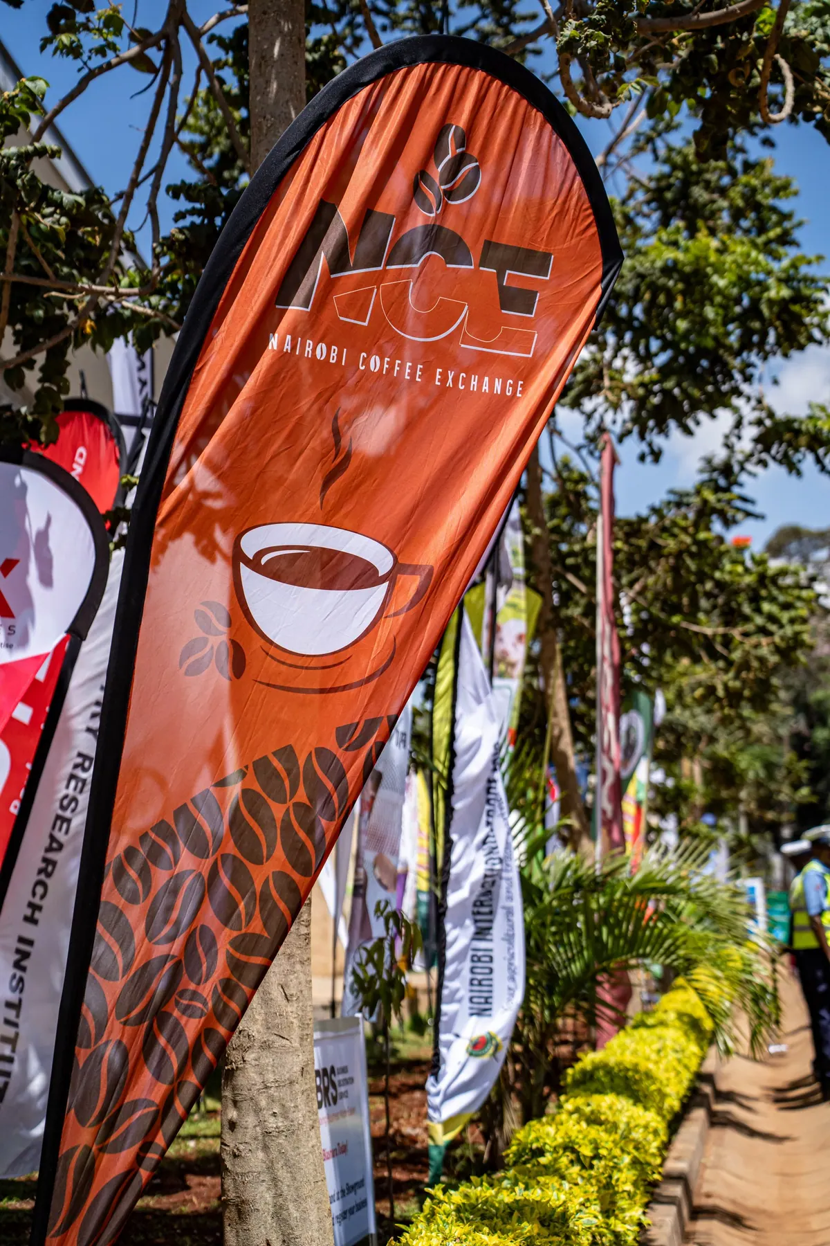 A Nairobi Coffee Exchange flag outside the stand